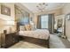 Elegant main bedroom features a stylish chandelier, large artwork, and abundant natural light at 504 S Armenia Ave # 1338, Tampa, FL 33609