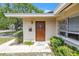 Close-up of the front door with a mailbox and landscaped greenery at 5065 Shore Acres Ne Blvd, St Petersburg, FL 33703