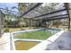 Outdoor in ground pool with enclosed screened frame and lots of space at 5065 Shore Acres Ne Blvd, St Petersburg, FL 33703