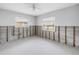 Clean, empty room with two windows and bare walls, ready for customization at 5065 Shore Acres Ne Blvd, St Petersburg, FL 33703