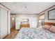 Comfortable bedroom with an opening to the bathroom, and a door to the hallway at 5428 Joyce St, Zephyrhills, FL 33542