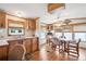 Open-concept dining area adjacent to kitchen with a window overlooking the outside at 5428 Joyce St, Zephyrhills, FL 33542