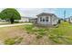 Single-story home with covered parking and minimal landscaping in a residential neighborhood at 5428 Joyce St, Zephyrhills, FL 33542