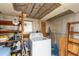 The laundry has a washing machine with shelving for storage at 5428 Joyce St, Zephyrhills, FL 33542