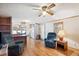 Inviting living room features hardwood floors, ceiling fan, and comfortable seating area at 5428 Joyce St, Zephyrhills, FL 33542