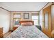 Well-lit main bedroom has two windows, closet and attached bathroom at 5428 Joyce St, Zephyrhills, FL 33542
