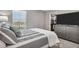 Bedroom with gray dresser, TV, view out the window, and closet with organized storage at 5486 Summer Sunset Dr, Apollo Beach, FL 33572