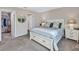 A bedroom with a bed, ensuite bathroom, closet, and a serene atmosphere at 5486 Summer Sunset Dr, Apollo Beach, FL 33572