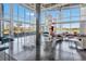 Spacious clubhouse lounge area with floor to ceiling windows, modern furniture, and lake views at 5486 Summer Sunset Dr, Apollo Beach, FL 33572
