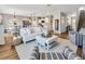 Bright, open-concept living room featuring hardwood floors and an inviting color palette at 5486 Summer Sunset Dr, Apollo Beach, FL 33572