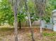 Exterior image of a grassy lot with trees and a wooden fence at 5720 21St W St, Bradenton, FL 34207