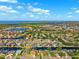 Stunning aerial view of waterfront homes with boat docks and lush landscaping along canals at 6104 Schooner Way, Tampa, FL 33615
