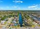 Breathtaking aerial view highlighting the waterfront homes with private docks and surrounding waterways at 6104 Schooner Way, Tampa, FL 33615