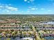 Expansive aerial showcasing waterfront homes with backyard docks surrounded by lush greenery and canals at 6104 Schooner Way, Tampa, FL 33615