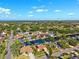 Scenic aerial view of homes along a waterfront canal neighborhood with lush greenery at 6104 Schooner Way, Tampa, FL 33615