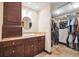 Bathroom with granite countertop sink and large walk-in closet at 6104 Schooner Way, Tampa, FL 33615