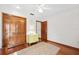 Cozy bedroom with hardwood floors, ceiling fan, and ample closet space at 6104 Schooner Way, Tampa, FL 33615