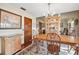 Inviting dining room featuring wood floors, matching furniture, and natural light at 6104 Schooner Way, Tampa, FL 33615
