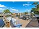 Dock view overlooking the tranquil water, featuring a boat lift and seating area to enjoy the scenery at 6104 Schooner Way, Tampa, FL 33615