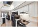 Bright kitchen features white cabinets and black appliances at 6104 Schooner Way, Tampa, FL 33615