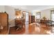 Bright living room with hardwood floors, vintage furnishings and golf-themed decorations at 6104 Schooner Way, Tampa, FL 33615