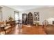 Open-concept living room featuring hardwood floors and eclectic furnishings at 6104 Schooner Way, Tampa, FL 33615