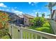 Backyard view featuring a fenced in pool with screened enclosure surrounded by lush landscaping and grass at 6104 Schooner Way, Tampa, FL 33615