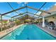 Enjoy the backyard pool and patio with covered lounging area, perfect for outdoor entertaining and relaxation at 6104 Schooner Way, Tampa, FL 33615