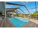The backyard features a private pool with enclosed patio, ideal for relaxation and outdoor entertaining at 6104 Schooner Way, Tampa, FL 33615