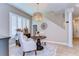 Charming dining area featuring shuttered windows, elegant seating, and stylish decor at 6201 Marbella Blvd, Apollo Beach, FL 33572