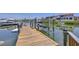 Private wooden dock with boat lift and waterfront access at 6201 Marbella Blvd, Apollo Beach, FL 33572