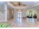 Elegant foyer with high ceilings, tile floors, and decorative lighting at 6201 Marbella Blvd, Apollo Beach, FL 33572