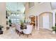 Expansive great room with soaring ceilings, tiled floors, and seamless flow to the kitchen at 6201 Marbella Blvd, Apollo Beach, FL 33572