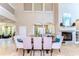 Bright great room featuring fireplace, travertine tile flooring, and an open floor plan at 6201 Marbella Blvd, Apollo Beach, FL 33572