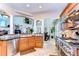 Modern kitchen with granite countertops, stainless steel appliances, and mosaic tile backsplash at 6201 Marbella Blvd, Apollo Beach, FL 33572