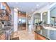 Kitchen features stainless steel appliances, granite countertops, and open layout to the rest of the house at 6201 Marbella Blvd, Apollo Beach, FL 33572