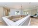 Upper landing with chandelier and decorative trim at 6201 Marbella Blvd, Apollo Beach, FL 33572