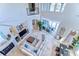 Bright living room with large windows, a fireplace, and cozy seating area at 6201 Marbella Blvd, Apollo Beach, FL 33572