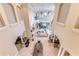Spacious living room with high ceilings, fireplace, and access to outdoor living areas at 6201 Marbella Blvd, Apollo Beach, FL 33572