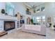 Spacious living area features a fireplace, high ceilings, and seamless access to an outdoor patio at 6201 Marbella Blvd, Apollo Beach, FL 33572