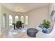 Bright home office with arched windows and comfortable seating at 6201 Marbella Blvd, Apollo Beach, FL 33572