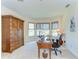 Bright office space featuring a wooden desk, built-in wardrobe, and bay windows with scenic views at 6201 Marbella Blvd, Apollo Beach, FL 33572