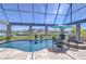 Screened pool area with waterfront views and outdoor seating at 6201 Marbella Blvd, Apollo Beach, FL 33572