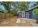 Well-maintained backyard with a wooden fence and a serene atmosphere provided by mature trees at 6225 76Th N Ave, Pinellas Park, FL 33781