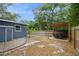 A well-kept backyard with a wood pergola over a dining set perfect for outdoor dining and entertainment at 6225 76Th N Ave, Pinellas Park, FL 33781