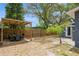 Backyard featuring a wood pergola, a table set, and a wooden fence for privacy at 6225 76Th N Ave, Pinellas Park, FL 33781