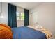 Comfortable bedroom with a queen size bed, blue bedding and bright natural light at 6225 76Th N Ave, Pinellas Park, FL 33781