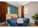 Bedroom with large windows and a queen-sized bed with a stylish honeycomb accent wall at 6225 76Th N Ave, Pinellas Park, FL 33781