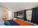 Well-lit bedroom with blue patterned wallpaper and access to ensuite bathroom at 6225 76Th N Ave, Pinellas Park, FL 33781