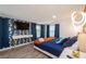 Stylish bedroom with modern lighting and decorative wallpaper accent wall at 6225 76Th N Ave, Pinellas Park, FL 33781